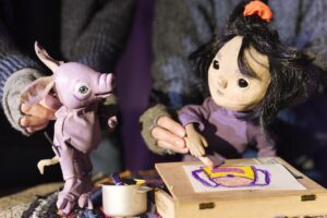 Puppets looking at each other